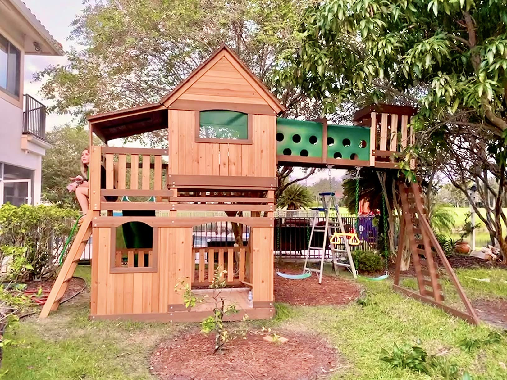 Backyard Discovery Woodridge Elite Cedar Wood Swing Set with Wave Slide, Clubhouse, Crawl Tunnel, Crow's Nest, Belt Swings, Trapeze, Rock Wall Ladder, Sandbox, Wrap-Around Porch, Deck, Outdoor Playset customer photo 2