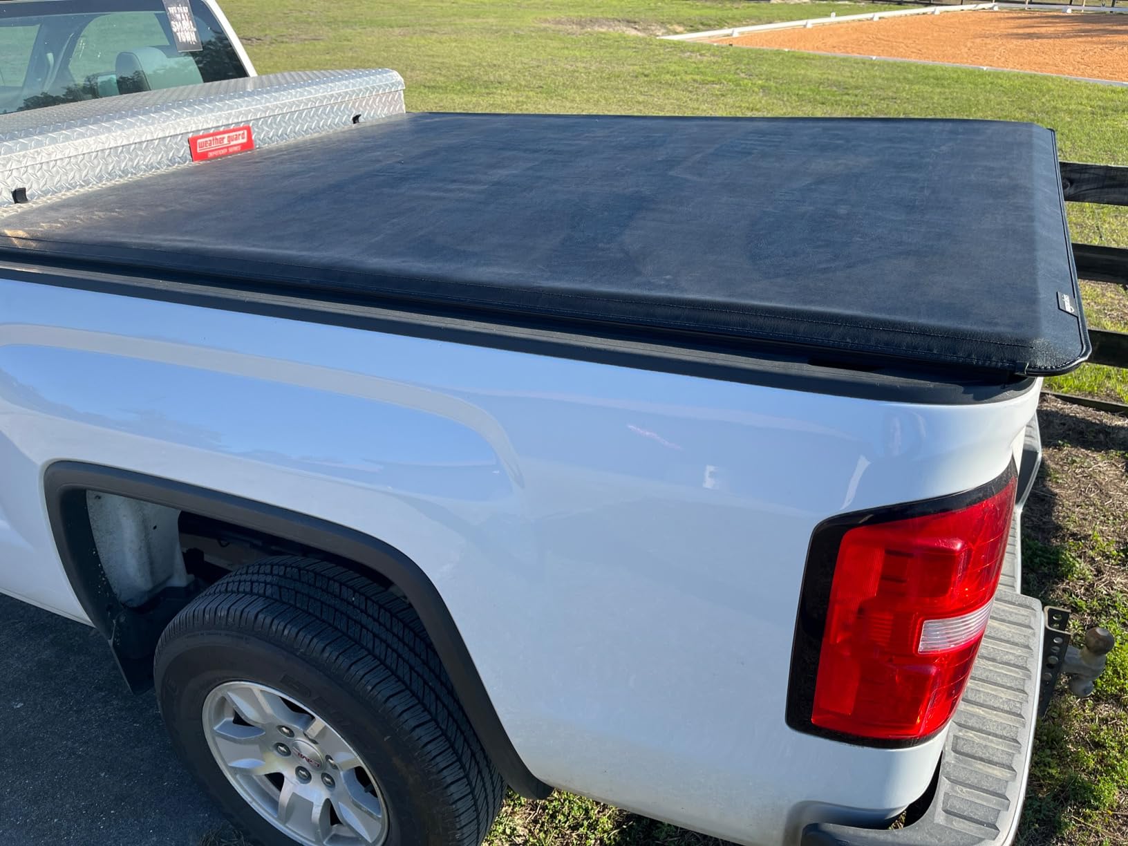 Amazon Basics Soft Roll-Up Truck Bed Tonneau Cover, 6.5 ft, Water-Resistant, Works with Bed Liners for 2014-2019 Chevy Silverado, GMC Sierra 1500, 2015-2018 Silverado Sierra 2500 3500 HD, Fleetside customer photo 1