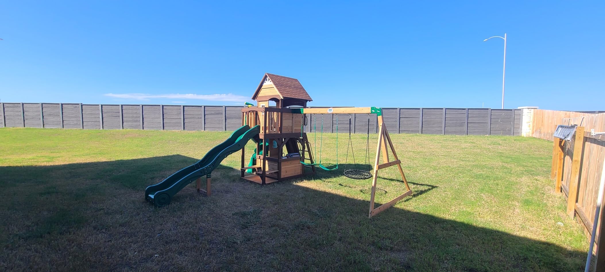 Backyard Discovery Cedar Cove Cedar Wood Swing Set with Spiral Tube Slide, Wave Slide, Clubhouse, Toy Grill, Snack Bar, Rock Wall, Belt Swings, Web Swing, Balcony, Chalkboard, Ladder, Outdoor Playset customer photo 2