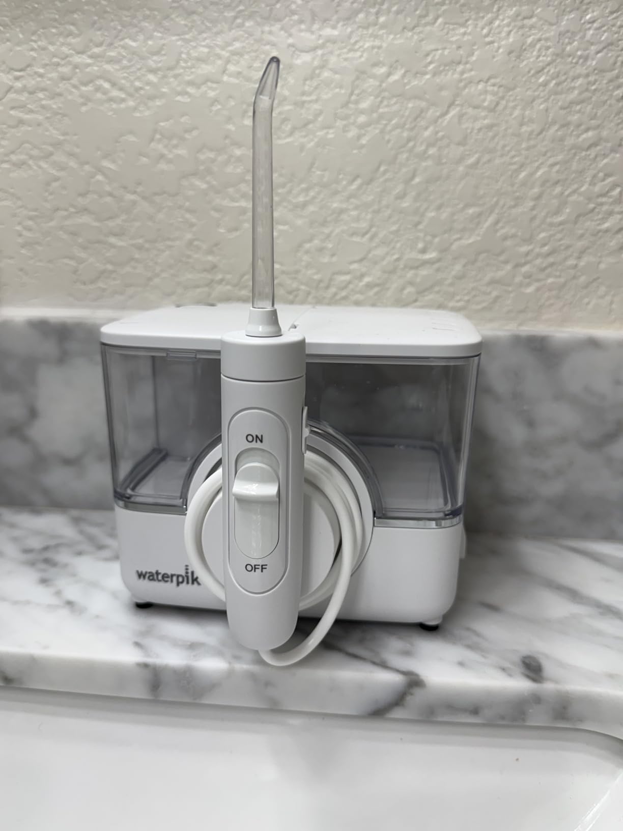 Waterpik ION Rechargeable Water Flosser with 10 Settings, 7 Tips, White customer photo 1